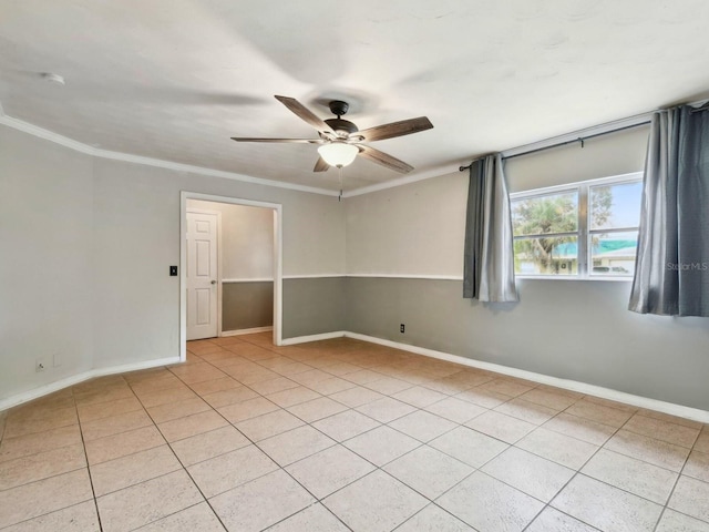 tiled spare room featuring ceiling fan and ornamental molding