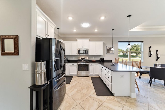 kitchen featuring white cabinets, pendant lighting, appliances with stainless steel finishes, and kitchen peninsula