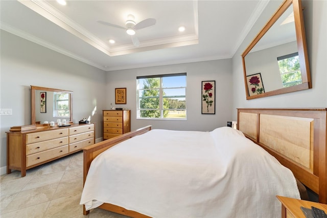 bedroom featuring ceiling fan, a raised ceiling, and crown molding