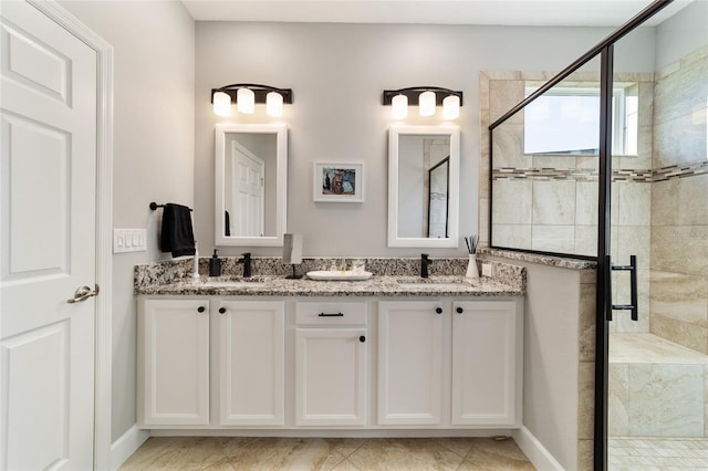 bathroom with tile patterned flooring, an enclosed shower, and vanity