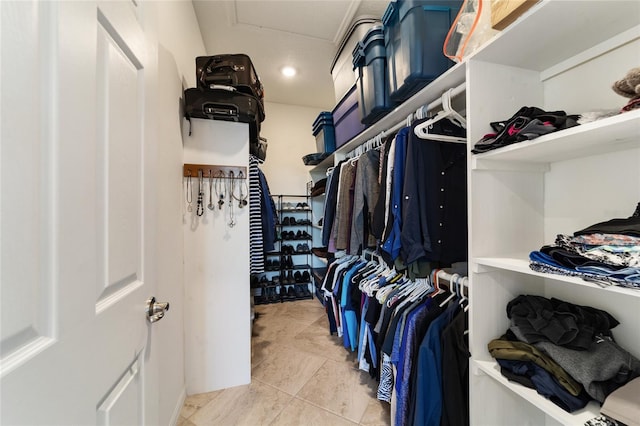 spacious closet featuring tile patterned floors