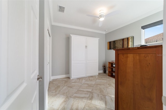 unfurnished bedroom with crown molding, a closet, and ceiling fan