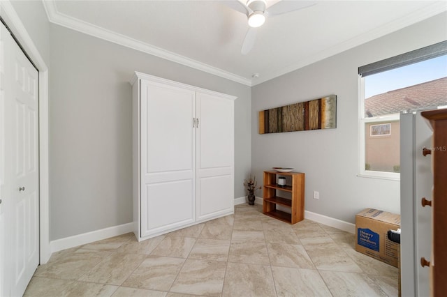 unfurnished bedroom with ceiling fan, a closet, and crown molding