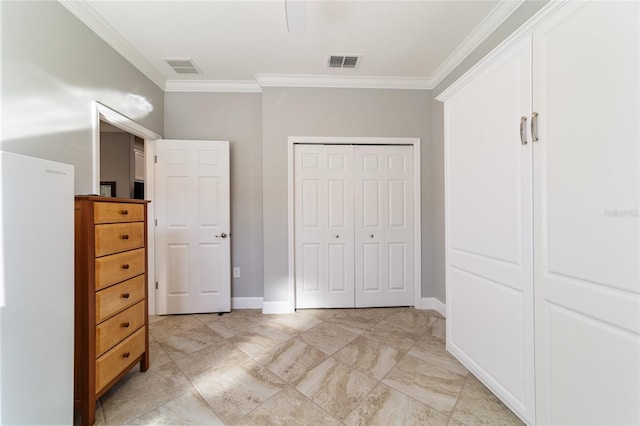 unfurnished bedroom featuring a closet and ornamental molding