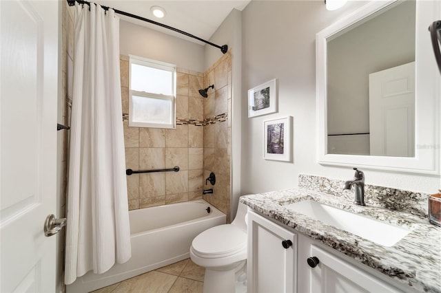 full bathroom with shower / bath combo with shower curtain, toilet, tile patterned flooring, and vanity