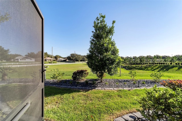 view of yard with a rural view