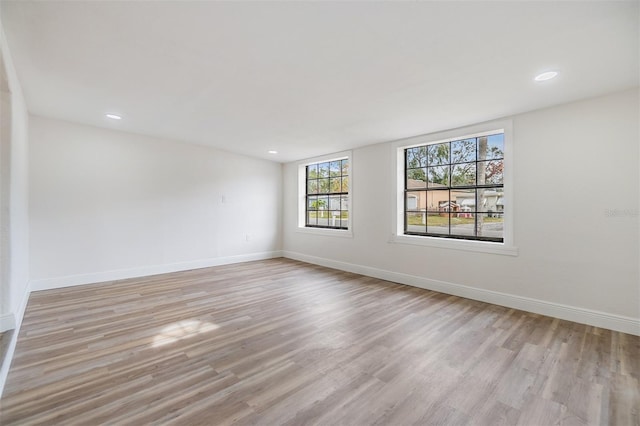 empty room with light hardwood / wood-style floors