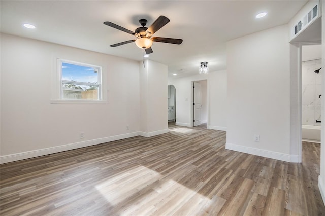 unfurnished room with ceiling fan and light hardwood / wood-style floors