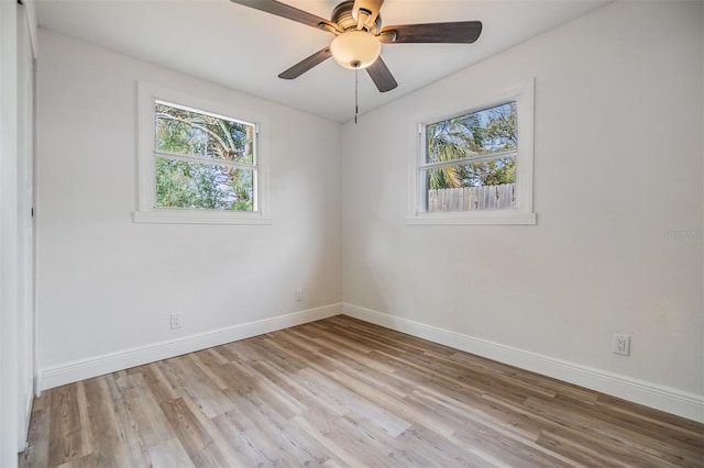 spare room with light hardwood / wood-style flooring and ceiling fan