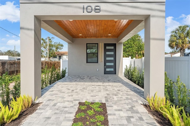 property entrance featuring a patio