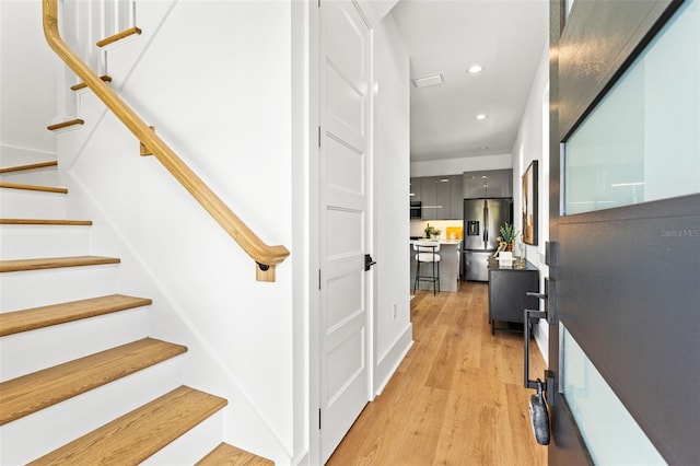 staircase featuring hardwood / wood-style floors