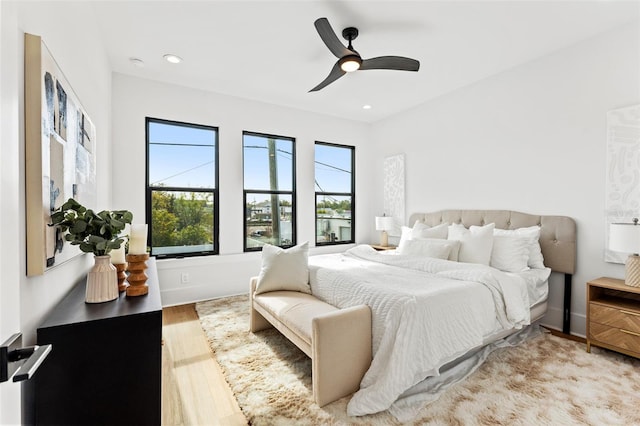 bedroom featuring ceiling fan and light wood-type flooring