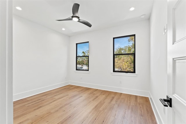 unfurnished room with ceiling fan and light hardwood / wood-style floors