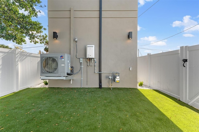 exterior space featuring a lawn and ac unit