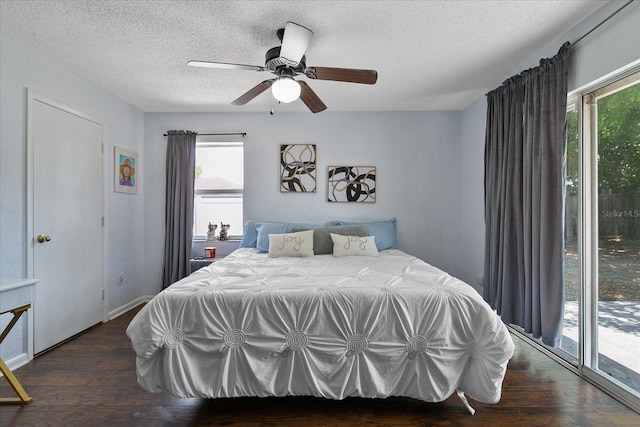 bedroom featuring dark hardwood / wood-style floors, access to outside, a textured ceiling, and ceiling fan