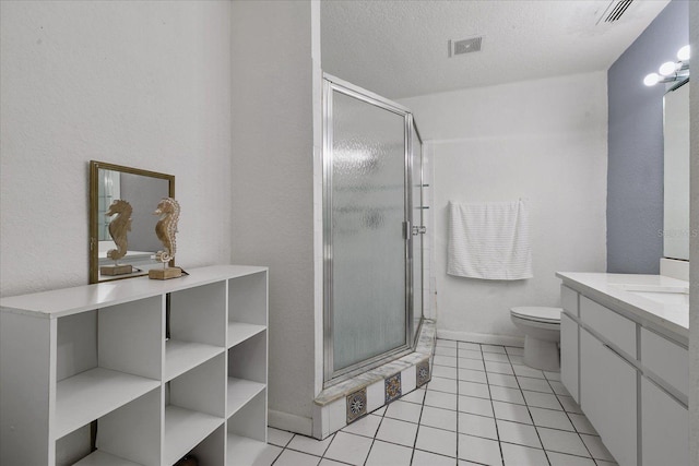 bathroom with walk in shower, toilet, a textured ceiling, vanity, and tile patterned flooring