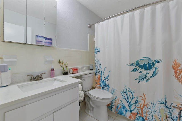 bathroom with tile patterned floors, toilet, a shower with curtain, tile walls, and vanity