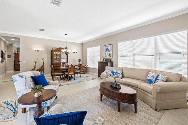 living room featuring light tile patterned flooring, ornamental molding, and a notable chandelier