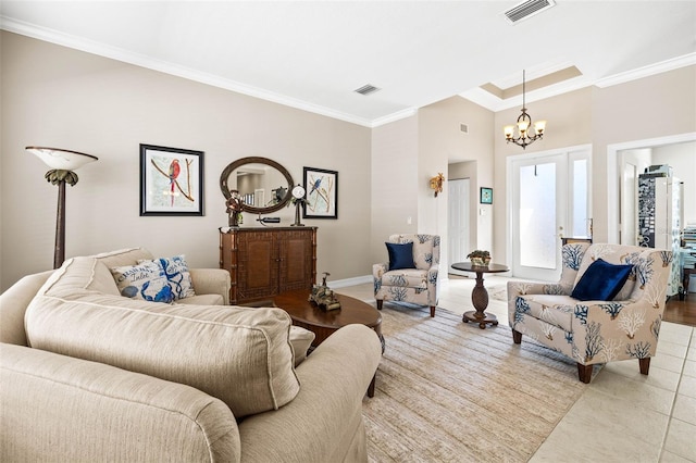 tiled living room featuring an inviting chandelier and ornamental molding