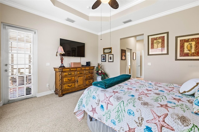 bedroom featuring ornamental molding, light colored carpet, a raised ceiling, and ceiling fan