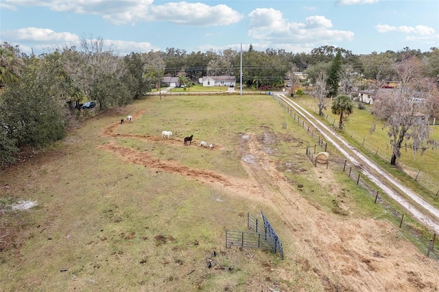 birds eye view of property with a rural view