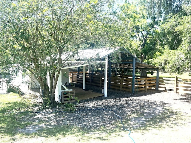 exterior space featuring an outbuilding and an exterior structure
