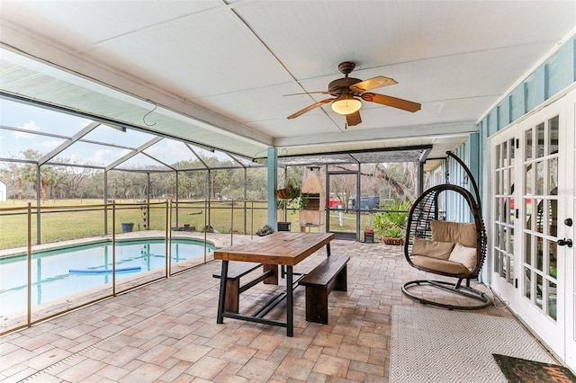 exterior space with a patio area, french doors, and glass enclosure
