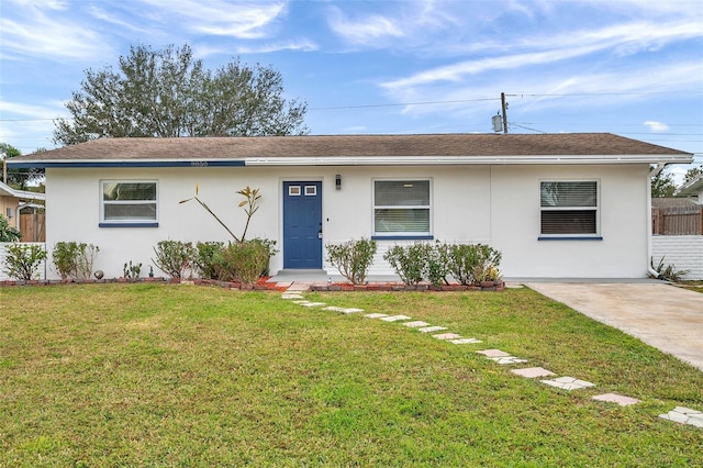 ranch-style home with a front lawn