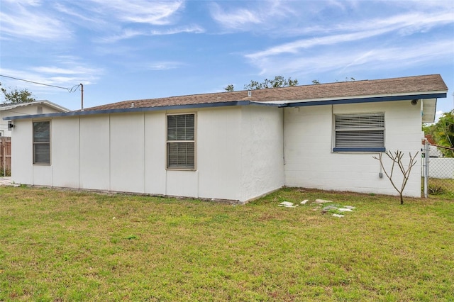 view of property exterior with a lawn