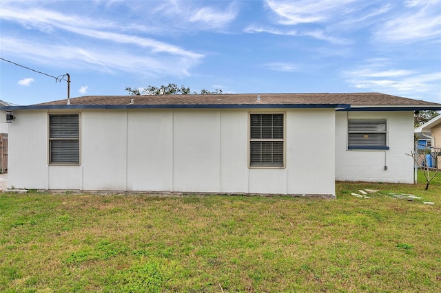 view of home's exterior with a lawn