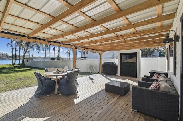 deck with a water view, grilling area, and outdoor lounge area