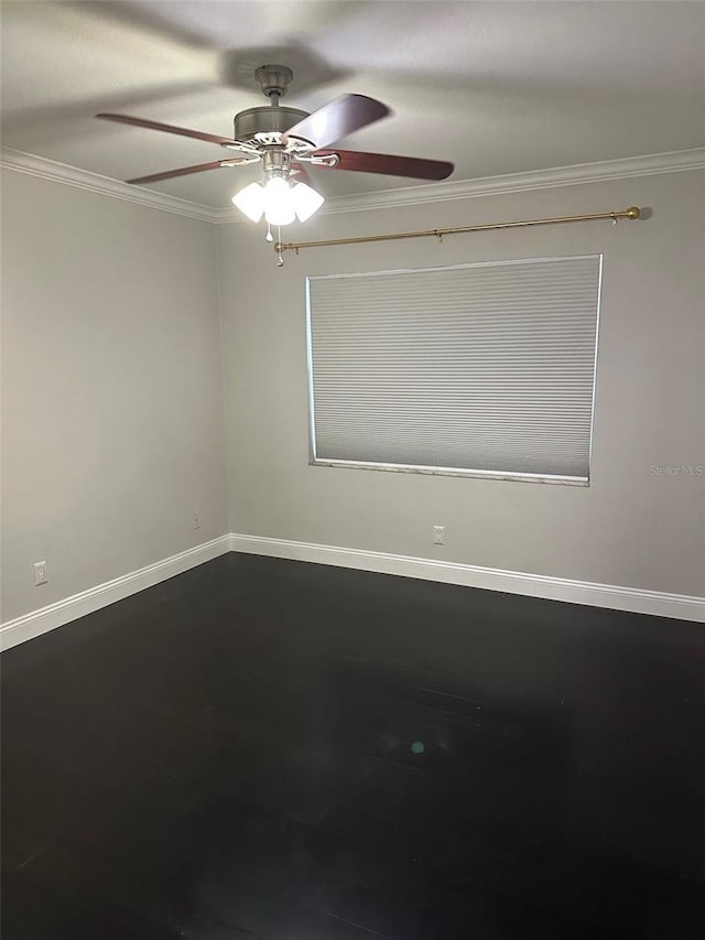 spare room with ornamental molding and ceiling fan