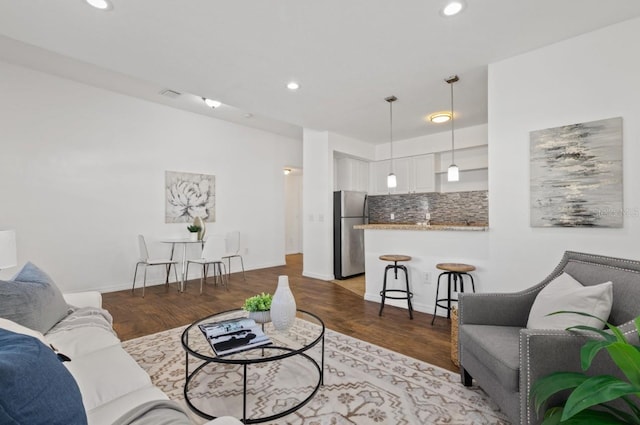 living room featuring dark hardwood / wood-style floors