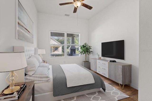 bedroom with ceiling fan and light hardwood / wood-style flooring