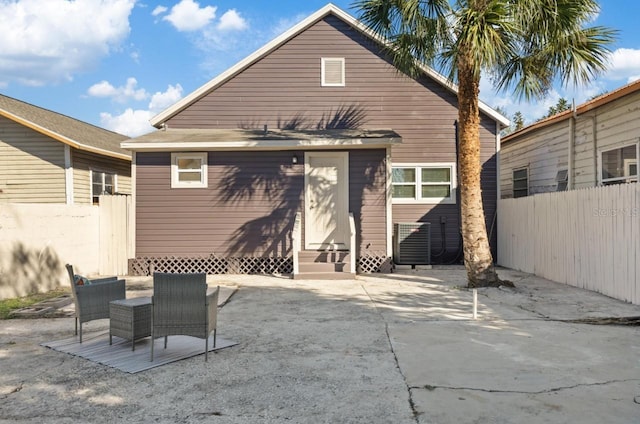 back of property with a patio