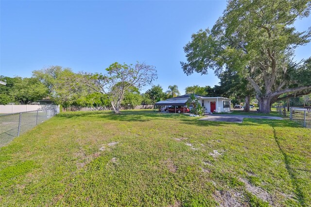 view of yard with a carport