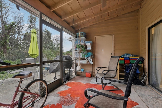 sunroom / solarium with wood ceiling and lofted ceiling with beams