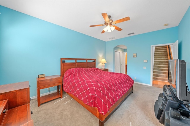 bedroom with light carpet, a closet, and ceiling fan