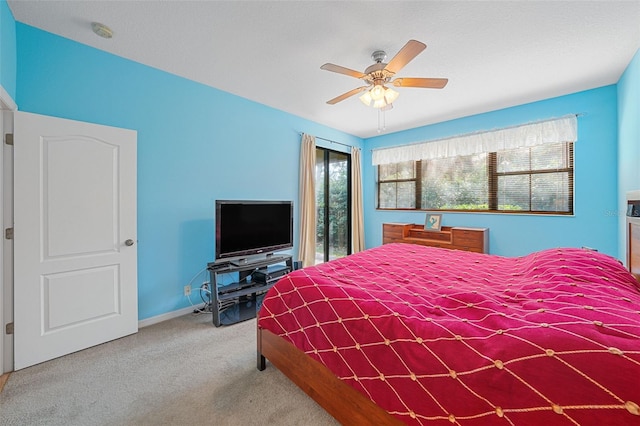 bedroom featuring light carpet and ceiling fan