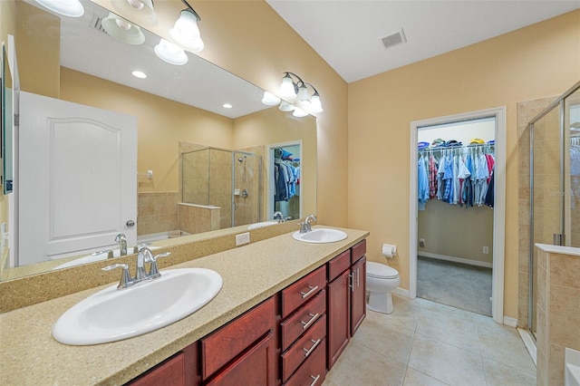 full bathroom featuring independent shower and bath, vanity, tile patterned flooring, and toilet