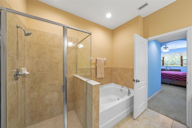 bathroom featuring separate shower and tub and tile patterned flooring