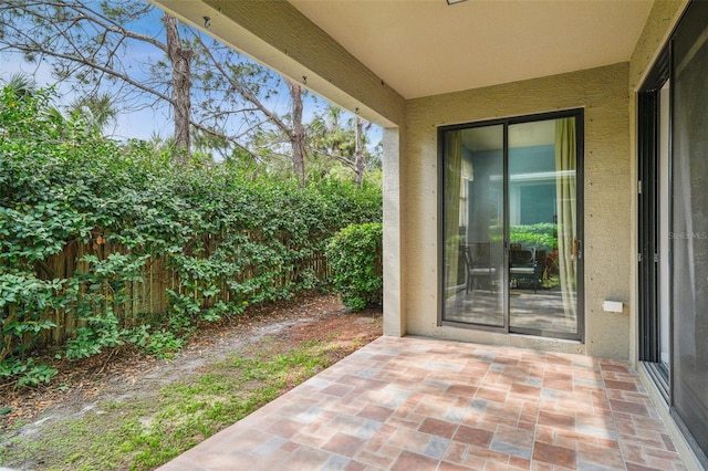 entrance to property featuring a patio area