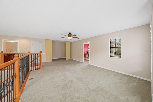 spare room with ceiling fan and carpet flooring