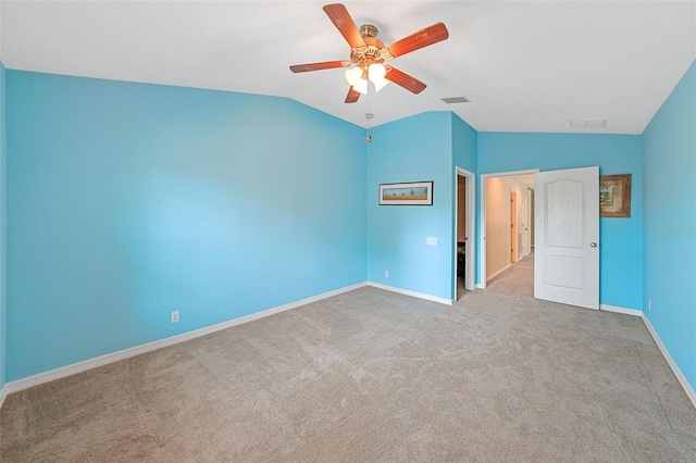 unfurnished bedroom with light carpet, vaulted ceiling, and ceiling fan