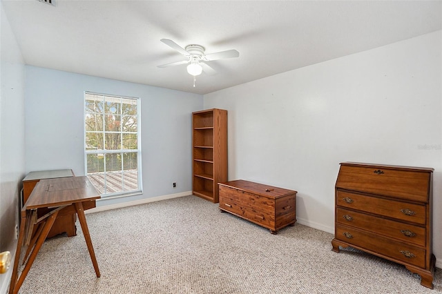 miscellaneous room with ceiling fan and light carpet