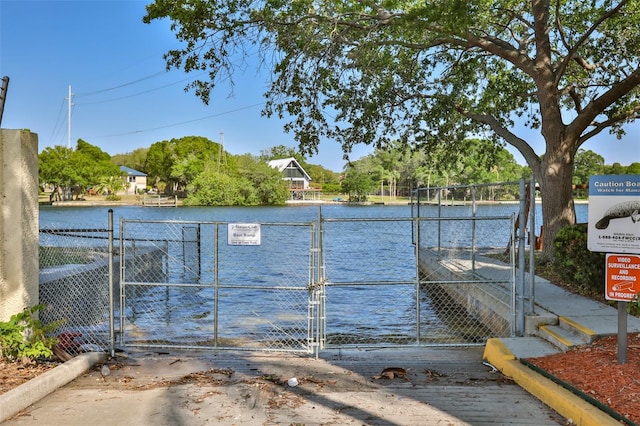 view of gate featuring a water view