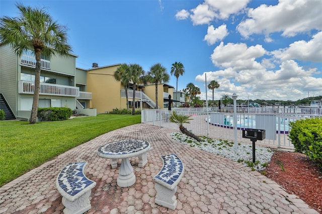 view of patio / terrace featuring a community pool