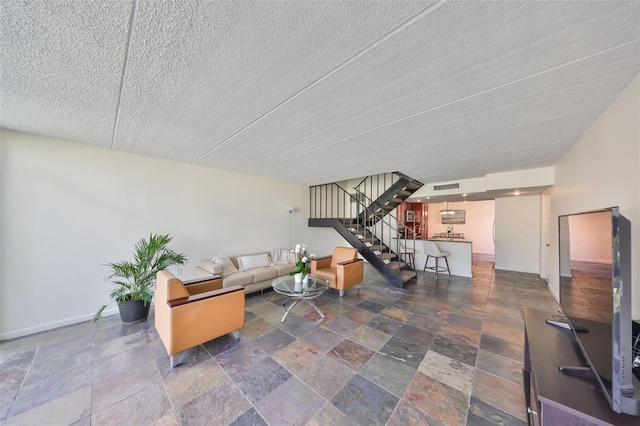 living room featuring a textured ceiling