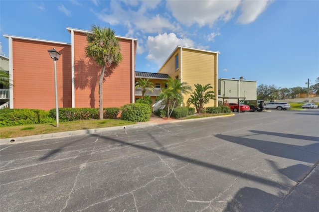 2424 W Tampa Bay Blvd Unit B201, Tampa, FL 33607 - view of building exterior featuring uncovered parking