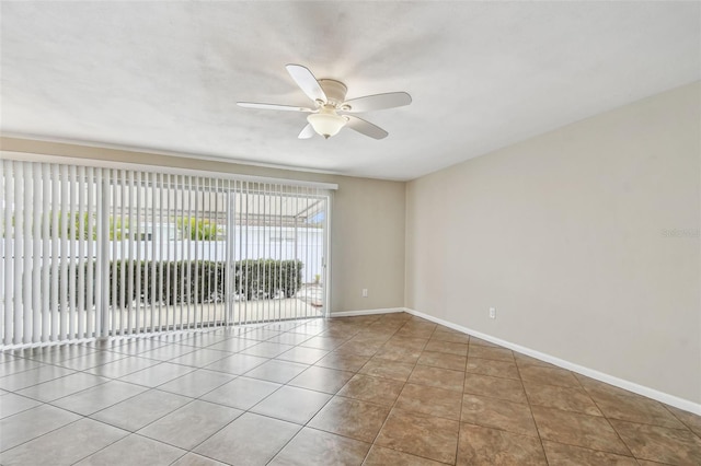 tiled empty room with ceiling fan